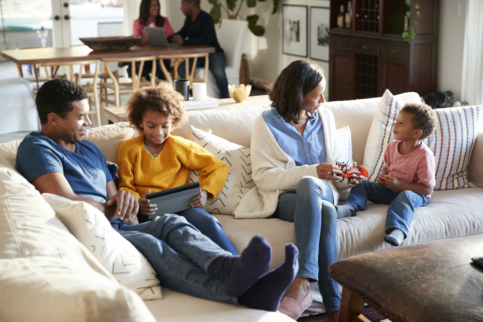 Three generation family family spending time in their open plan living room