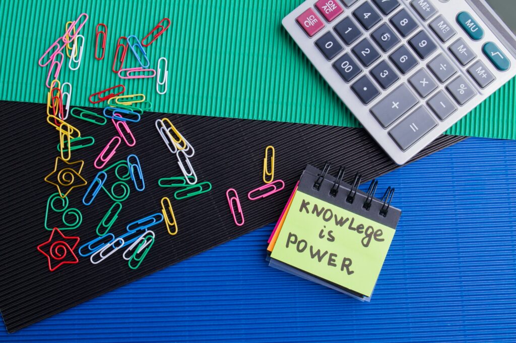 Knowledge is power concept top view flat lay.